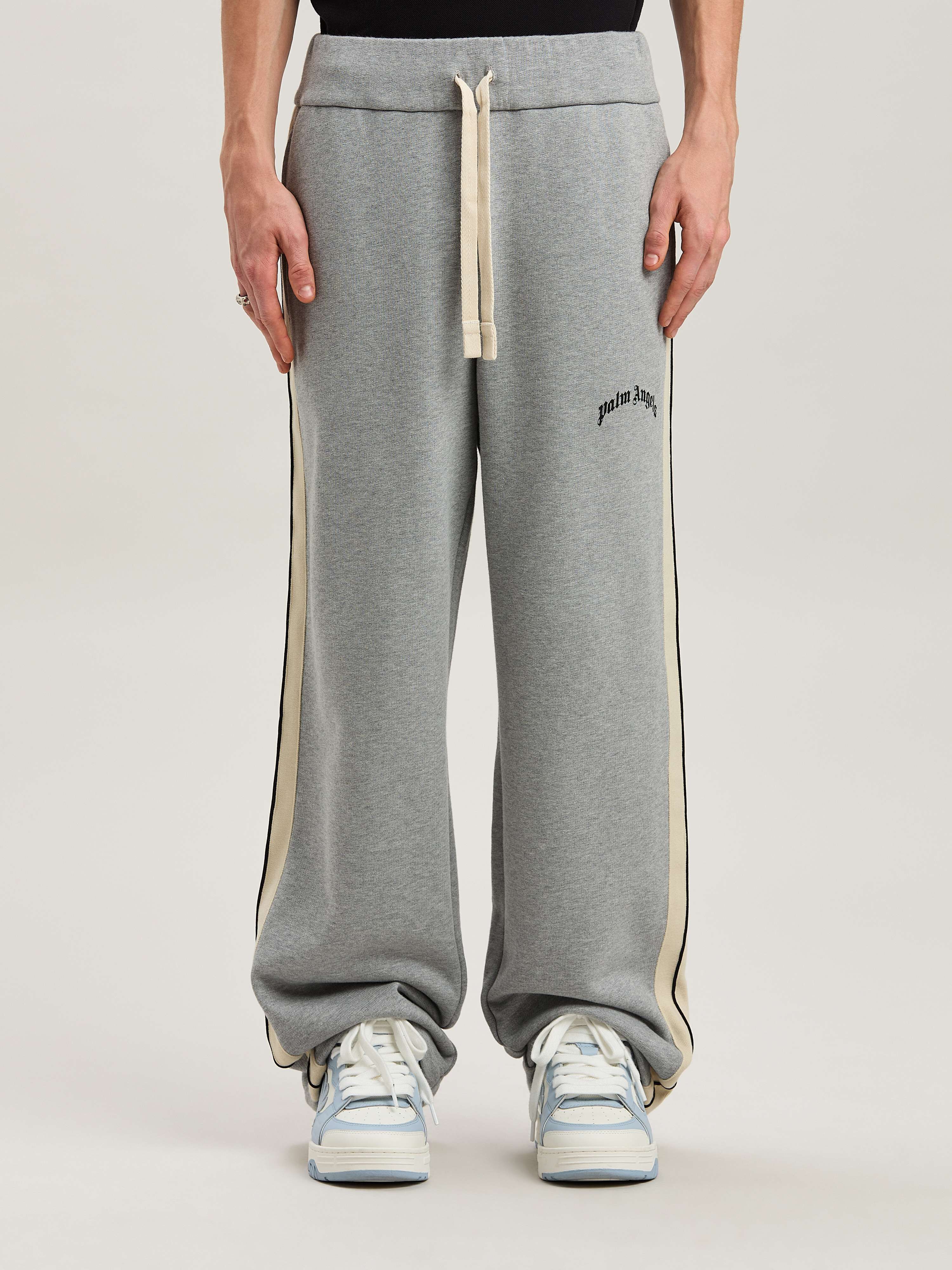 PALM ANGELS  CURVED LOGO TRACK SWEATPANTS GREY MELANG GREY MELANGE - BLACK PMCH02BS25FLE001