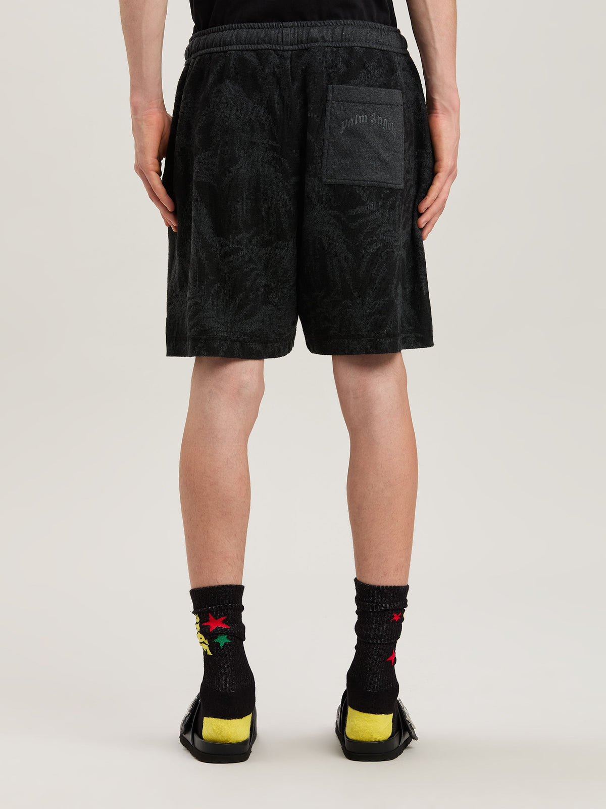 PALM ANGELS  PALMS CURVED LOGO SHORTS BLACK - GREY PMCI025S25FAB001