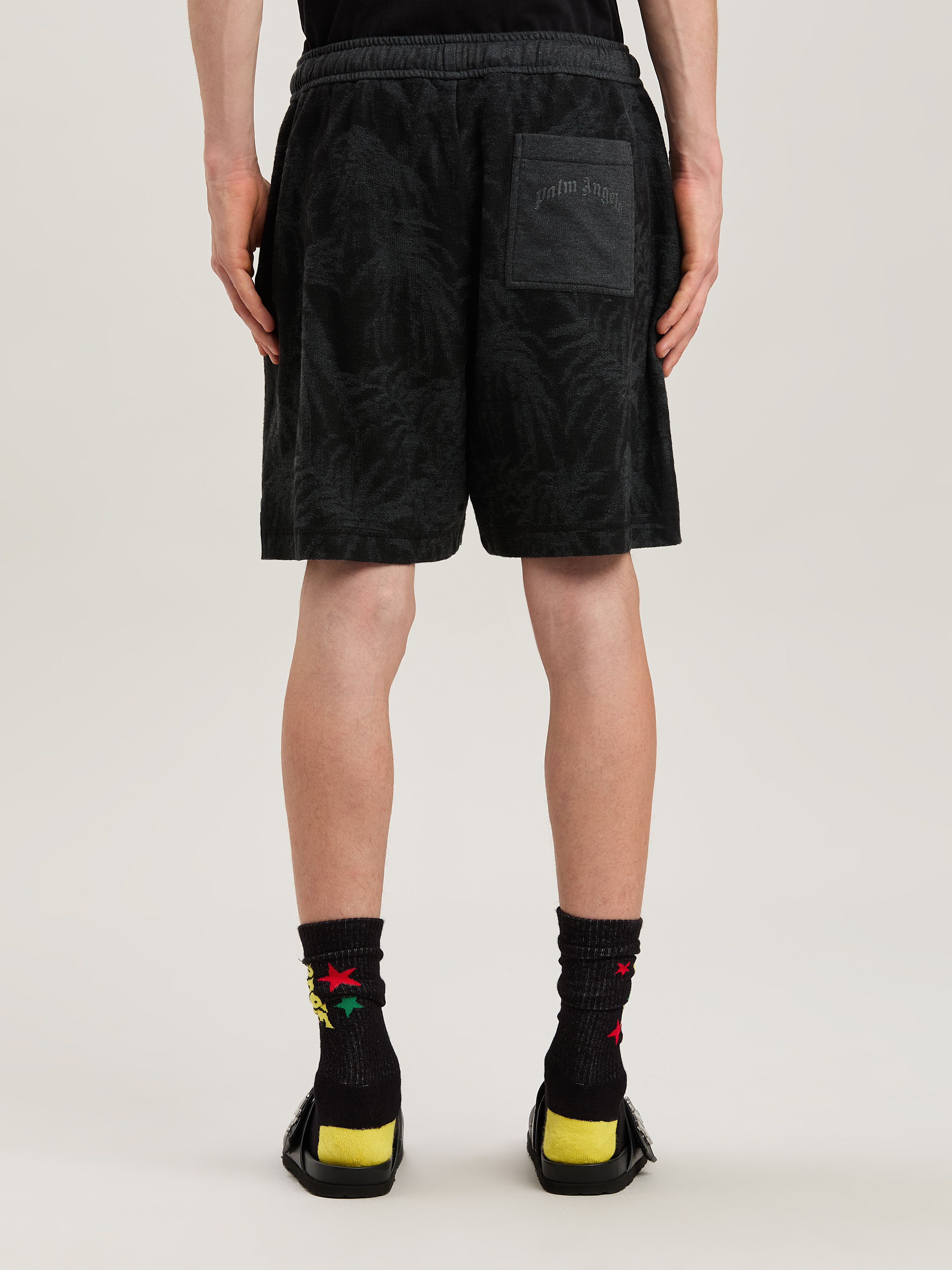 PALM ANGELS  PALMS CURVED LOGO SHORTS BLACK - GREY PMCI025S25FAB001
