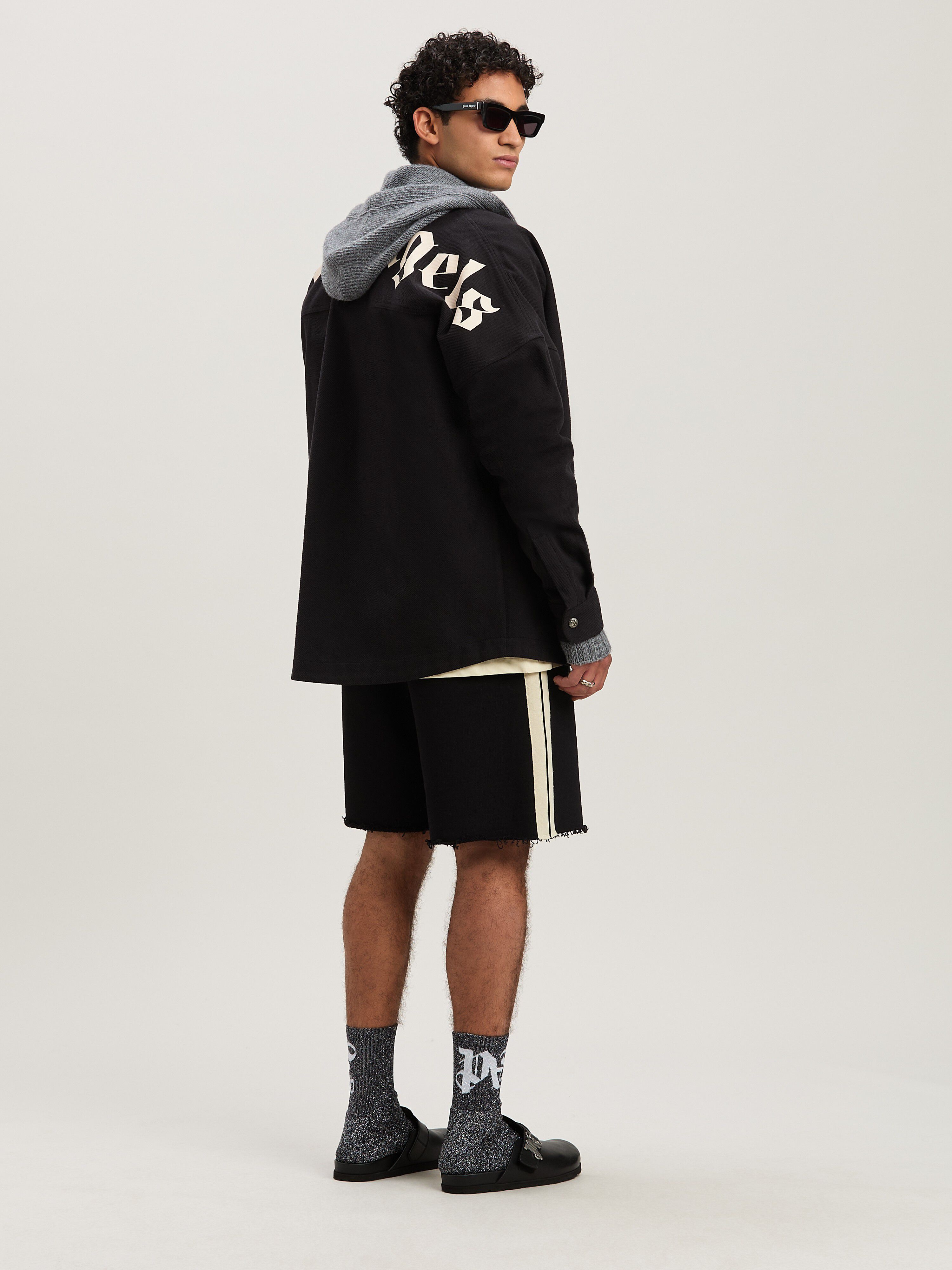 PALM ANGELS  CURVED LOGO TRACK SWEATSHORTS BLACK - IV BLACK - IVORY PMCI026S25FLE001