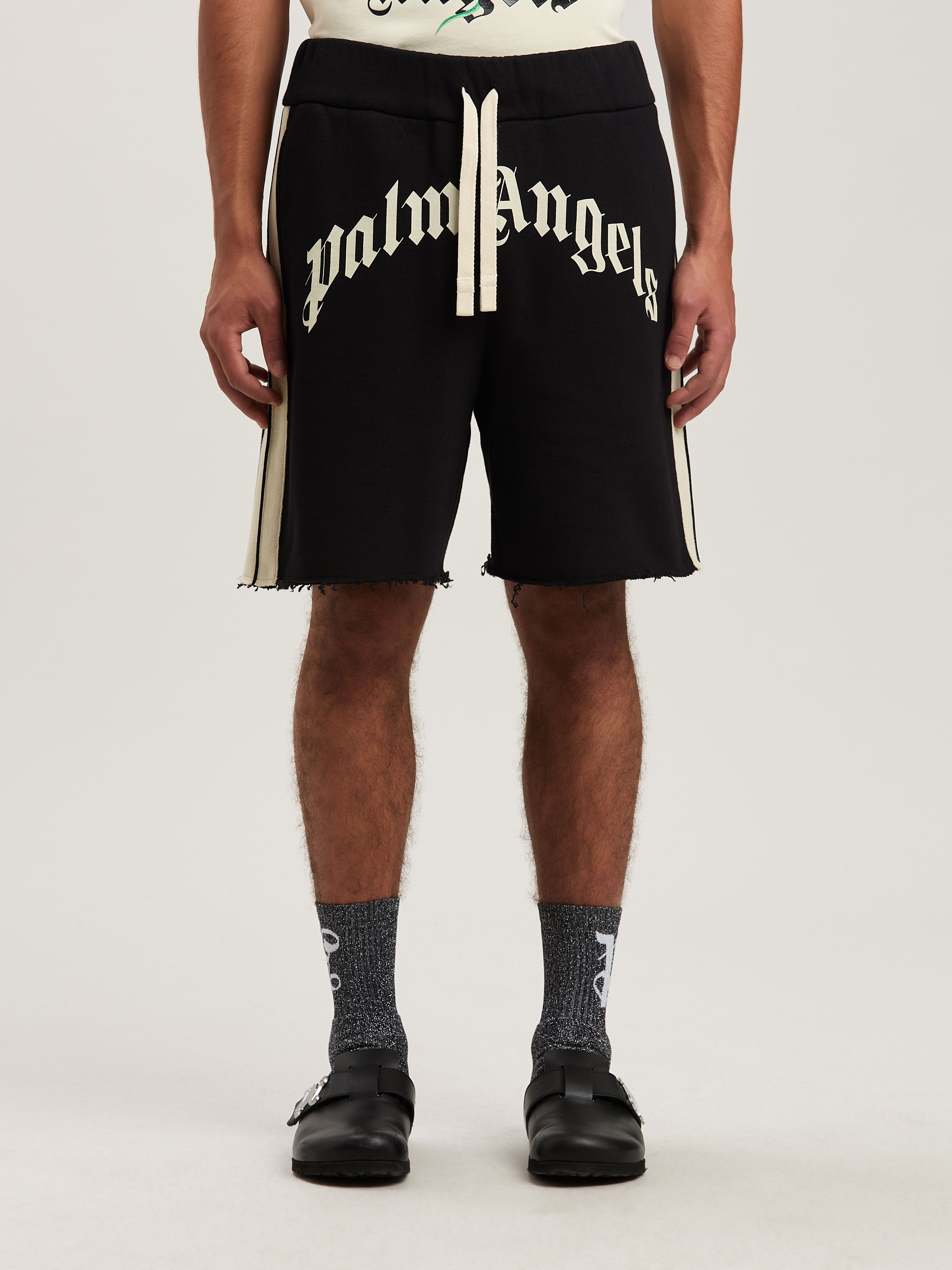 PALM ANGELS  CURVED LOGO TRACK SWEATSHORTS BLACK - IV BLACK - IVORY PMCI026S25FLE001