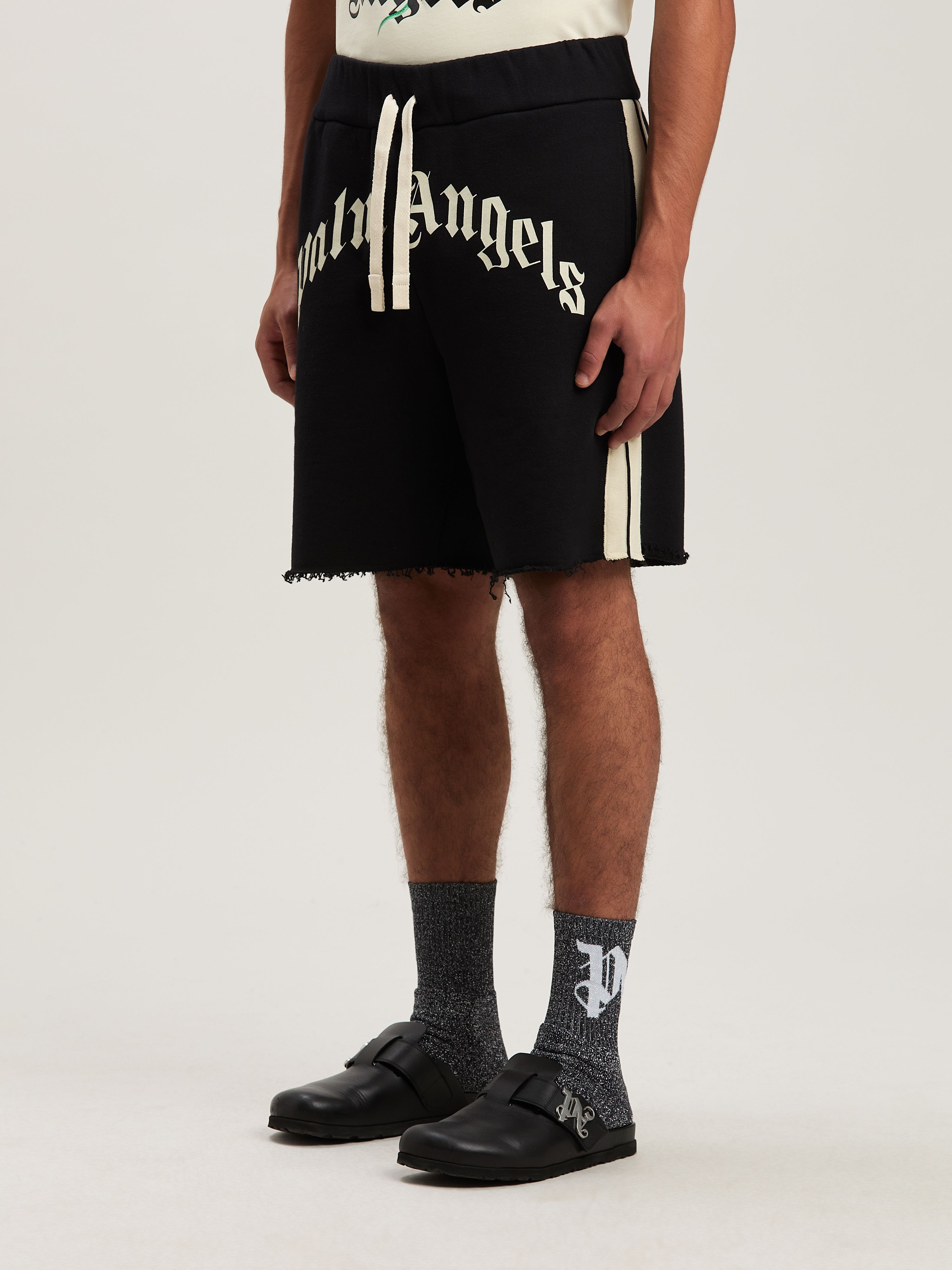PALM ANGELS  CURVED LOGO TRACK SWEATSHORTS BLACK - IV BLACK - IVORY PMCI026S25FLE001