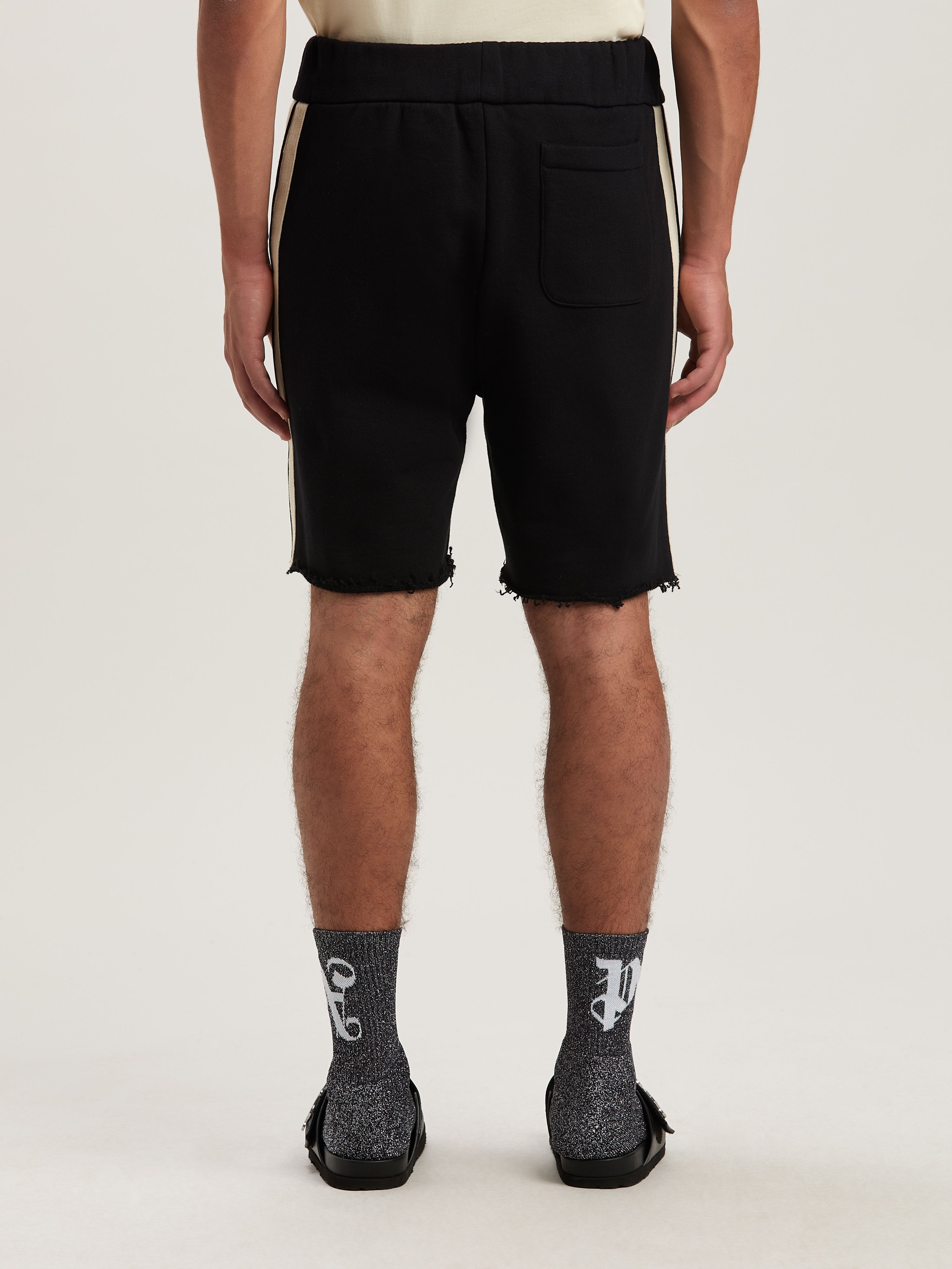 PALM ANGELS  CURVED LOGO TRACK SWEATSHORTS BLACK - IV BLACK - IVORY PMCI026S25FLE001