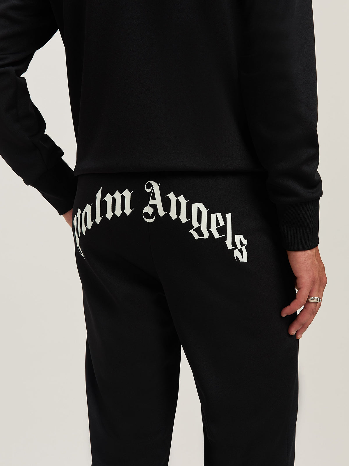 PALM ANGELS  BACK CURVED LOGO TRACK PANTS BLACK - OFF BLACK - OFF WHITE PMCJ048S25FAB001