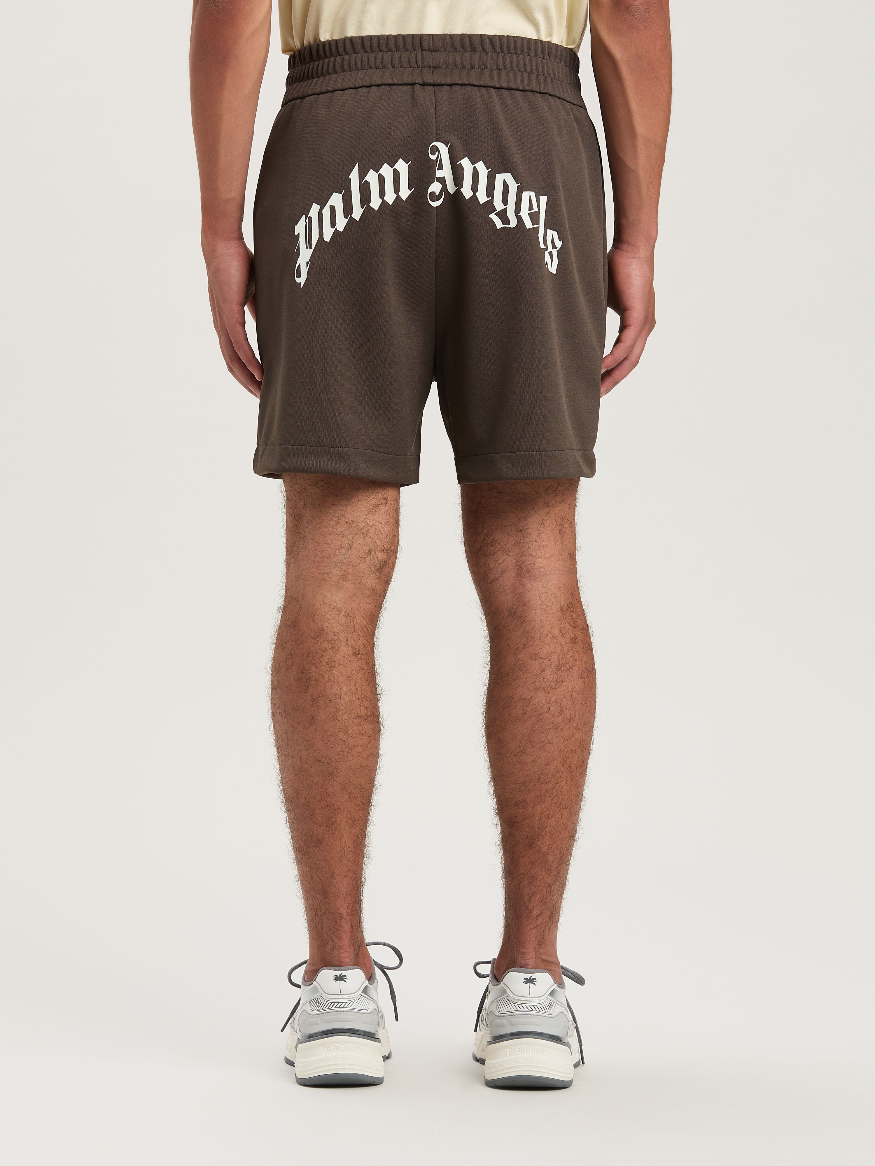 PALM ANGELS  BACK CURVED LOGO TRACK SHORTS VINTAGE BL VINTAGE BLACK - OFF WHITE PMCL008S25FAB001