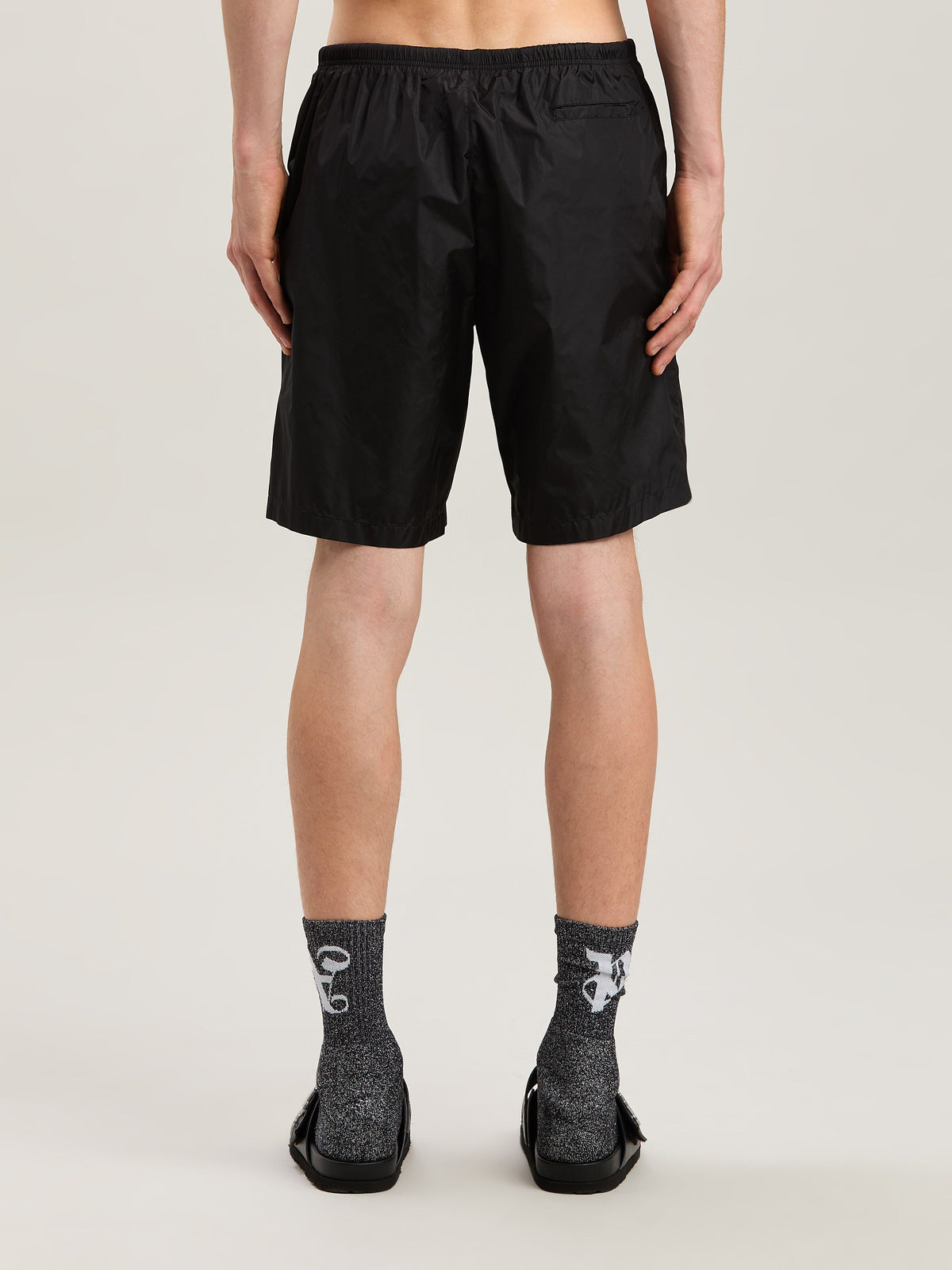 PALM ANGELS  CURVED LOGO SWIMSHORTS BLACK - OFF WHITE PMFD018S25FAB001