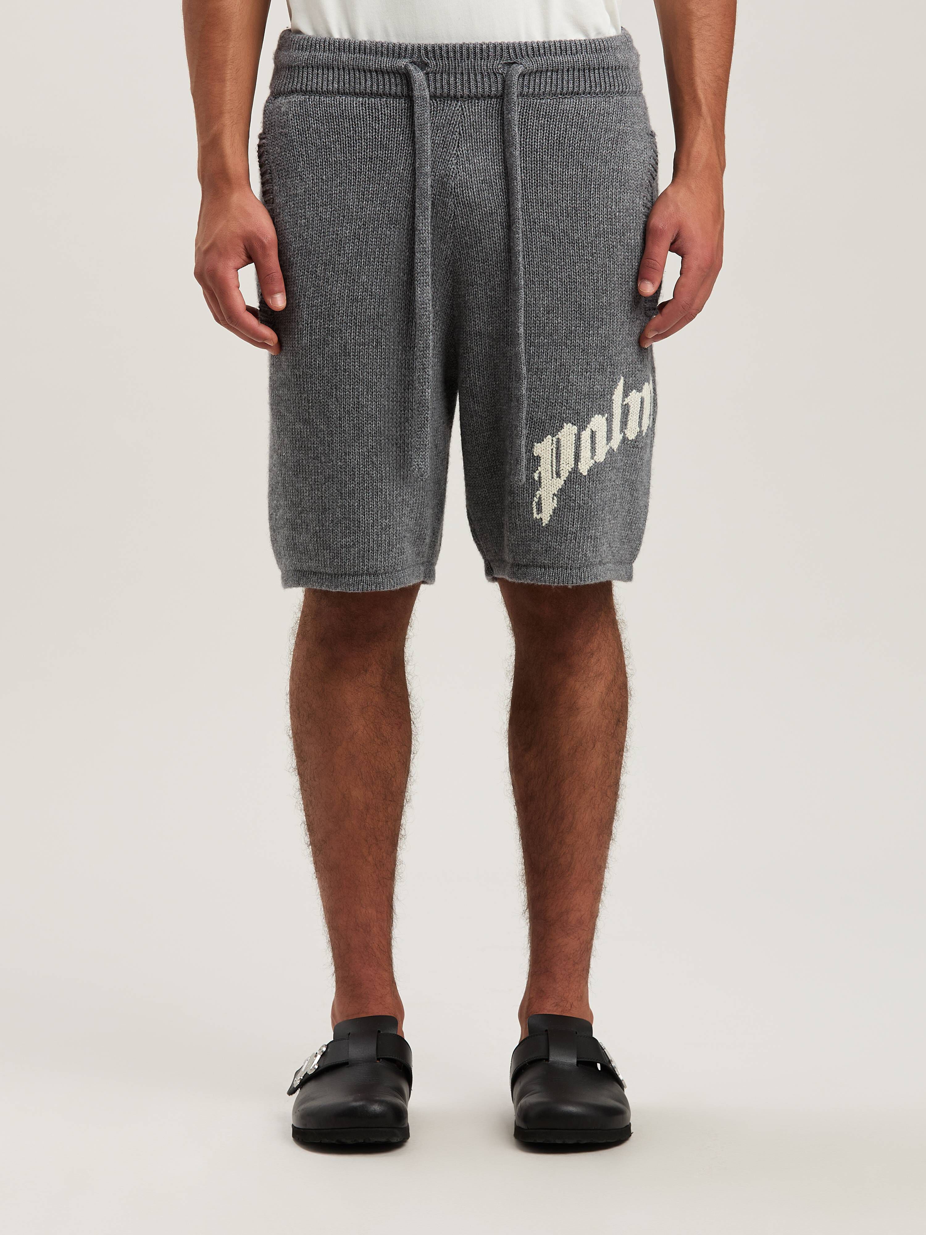PALM ANGELS  CURVED LOGO KNIT SHORTS GREY MELANGE - O GREY MELANGE - OFF WHITE PMHM011S25KNI001